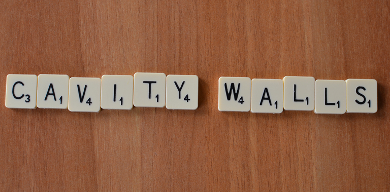 Scrabble spelling out cavity walls